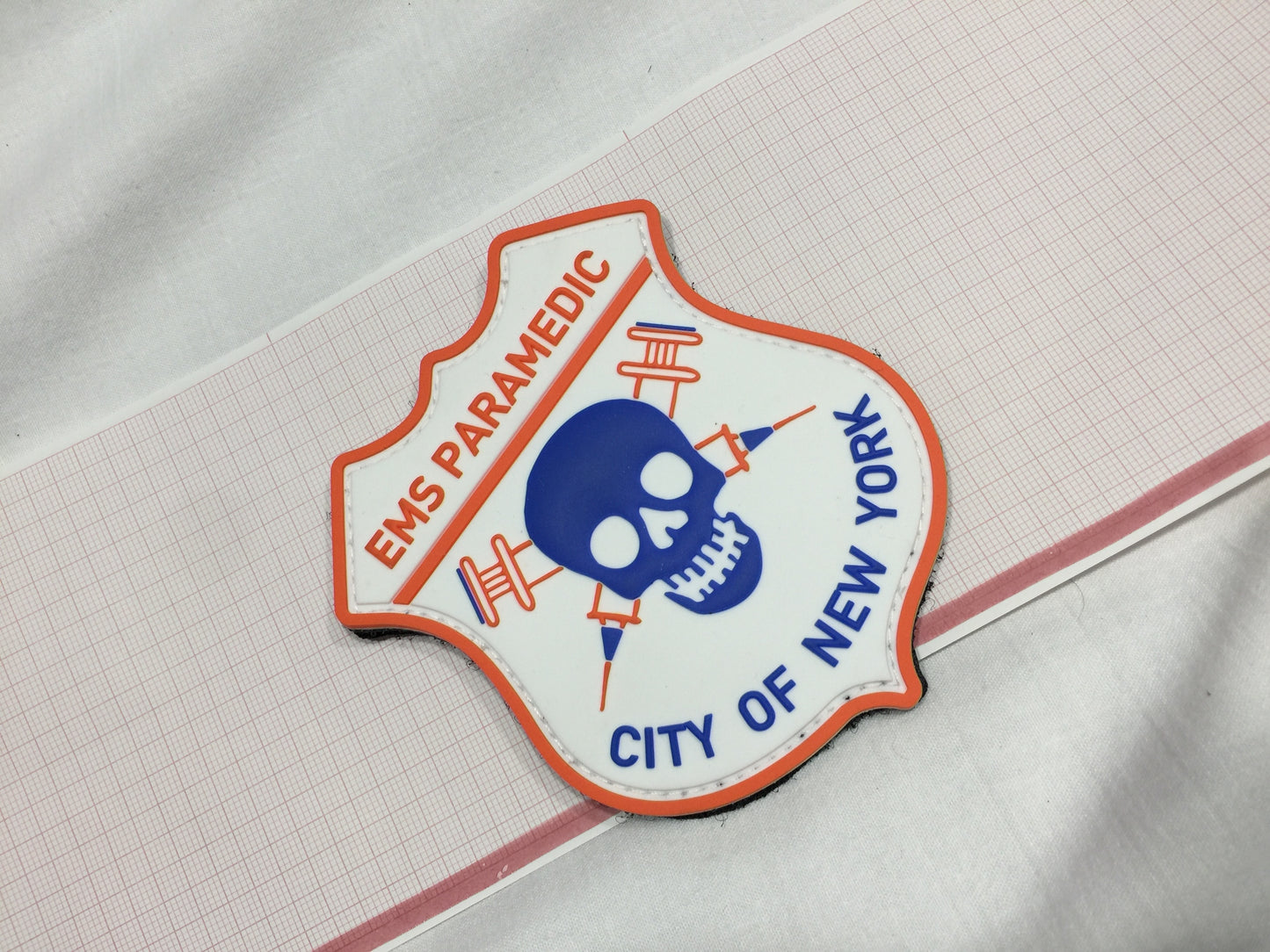 NYC skell city EMS Paramedic Velcro PVC patch on top of EKG paper